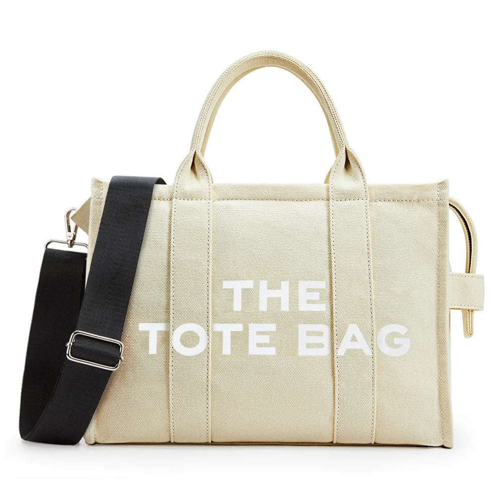 “Designer canvas tote bag, large capacity, adjustable shoulder strap, crossbody style.”