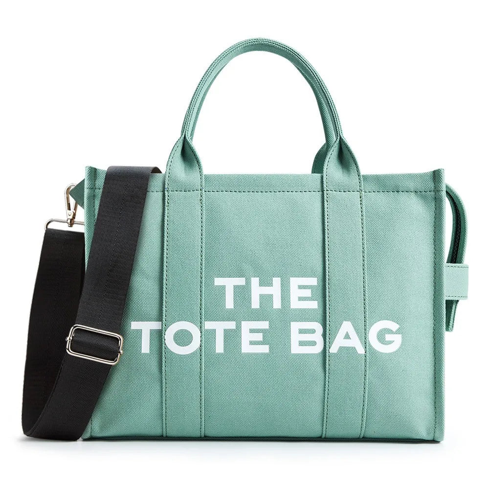 “Designer canvas tote bag, large capacity, adjustable shoulder strap, crossbody style.”