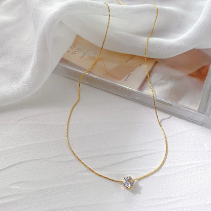 “Stainless Steel Gold Plated Zircon Necklace - Dainty Minimalist Clear CZ Charm for Women.”