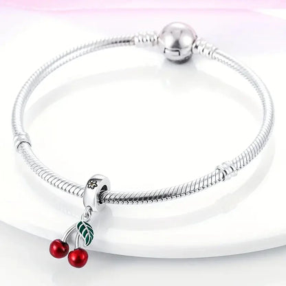 “Red enamel cherry charm beads for bracelet, necklace, keychain, DIY jewelry gift.”