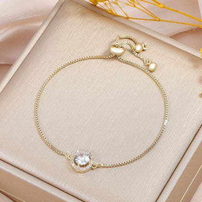 “Trendy Interlocked Gold-Color Circle Bangle for Women, Exquisite Party Jewelry.”