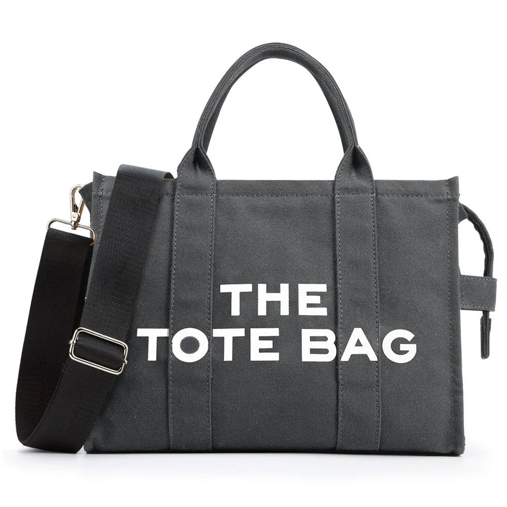 “Designer canvas tote bag, large capacity, adjustable shoulder strap, crossbody style.”