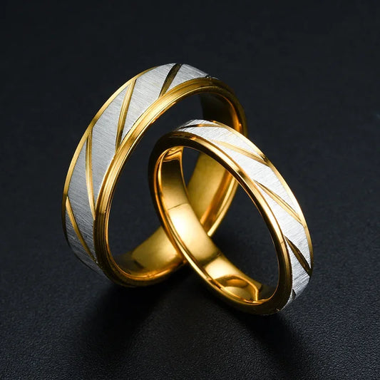 “Gold wave-pattern couple rings, stainless steel, perfect for weddings or promises.”