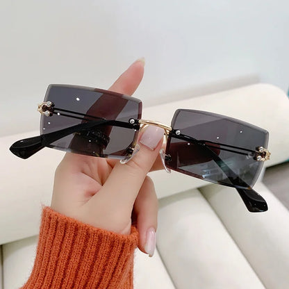 “Luxury rectangle rimless sunglasses, gradient colors, stylish unisex design.”