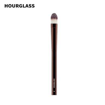 “Large concealer brush, soft fiber hair, flawless coverage, stylish makeup tool.”